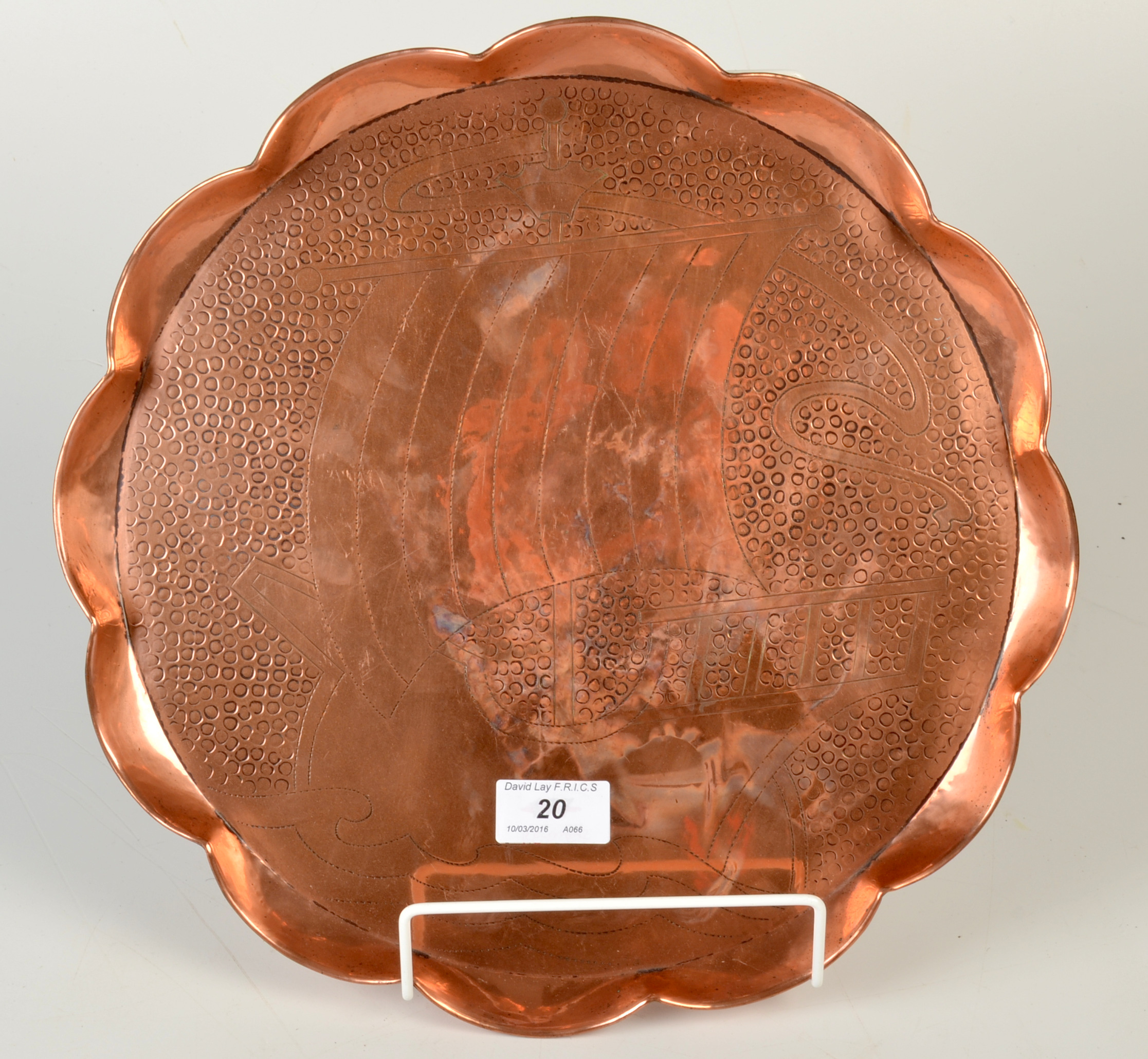 A Hayle, J. & F.Pool Copper lobed circular tray, relief decorated with a longboat. No.