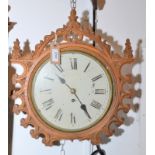 A 19th gothic carved oak dial clock with a single fusee movement, diameter 25cm.