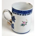A Chinese porcelain 18th century armorial mug painted with sprays of flowers, height 12.5cm.