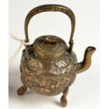 A Chinese miniature bronze teapot decorated with two dragons, height with handle extended 11cm.