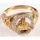 A 9ct. gold equestrian ring cast with a horse's head at the centre of a diamond set horse shoe.