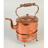 A Victorian copper oval kettle and warming stand.