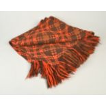 A Welsh woven throw with orange and brown geometric pattern, 90 x 160cm.