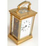 A brass carriage clock, height 11cm.