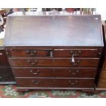 An early George III mahogany slope front bureau on ogee bracket feet, width 113cm.