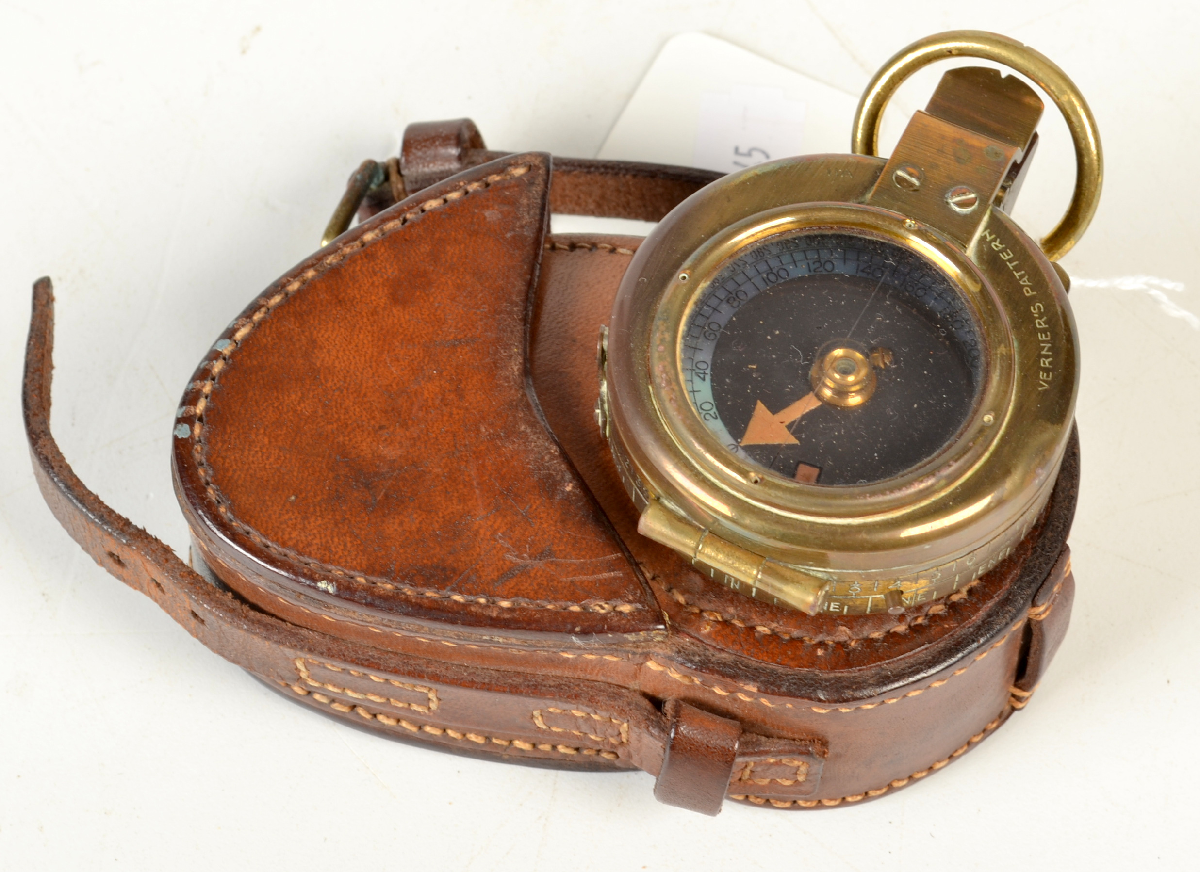A field prismatic compass ex-WD dated 1915 by Edward Koehn, Geneva, original leather case.