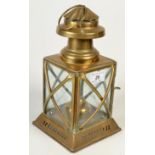 A square brass paraffin lantern, height excluding suspension ring 24cm.