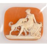 A Victorian rectangular cameo showing a seated woman with an anchor and a dog, 3 x 3.5cm.