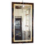 A Japanese black lacquered wall mirror, the frame with gilt decoration pagodas and floral sprays,