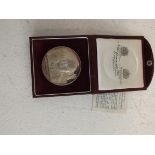 Churchill; A silver commemorative medallion by Spink and Son Ltd 80 grms cased.