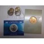 £2 Britannia 2004, two G.B. £5 coins, a peace medallion and two £2 coins.