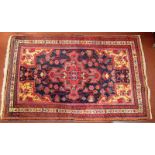 EXTRA LOT TO CATALOGUE A Hamadan Persian rug, the indigo field with a central medallion,