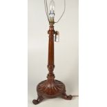 A Sheraton style mahogany table lamp with tripod base.