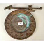 A cast brass dish and a bronze window stay.