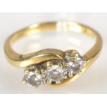 A three stone crossover diamond ring.