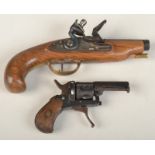 A small revolver with a folding trigger and a similar flintlock pistol.