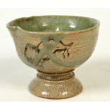 A Japanese pottery stem cup, early 19th century, with painted horse motif and celadon interior,