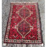 A Shiraz hand made wool rug,