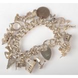 A heavy silver charm bracelet, 114g.