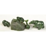 Four green stone animals.