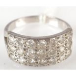 An 18ct. white gold ring pave set with three rows of seven diamonds.