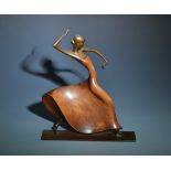 A Karl Hagenauer Viennese teak and brass sculpture in the form of a Spanish dancer,