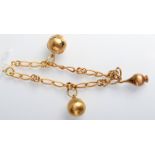 An 18ct. gold bracelet and three 18ct. gold chains, 18ct. gold charms, 16g.