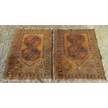 A pair of Afghan prayer rugs, each with two octagonal medallions within the mihrab,