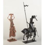 A scrap metal sculpture made as a mounted knight and an African copper figure group.