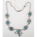 An Art Nouveau silver and turquoise necklace in Liberty style.