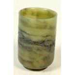 A Chinese green hardstone brush pot decorated with flowers and leaves, height 7.6cm.