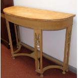 A 1920s light wood consol table, possibly sycamore, with pierced supports.