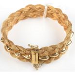 An 18ct. gold plaited wire bracelet 41.5g.