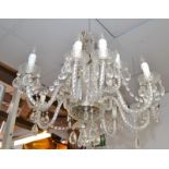 A good large, pendant twelve branch, glass lustre hung electrolier.