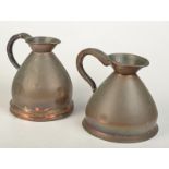 Two bellied copper half gallon measures, each with customs seal, each height 20cm.