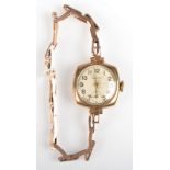 A Dennison 9ct. gold ladies wrist watch on 9ct. gold bracelet.