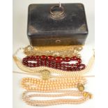 A 'cherry amber' necklace and other necklaces. Amber is 62.