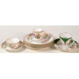 Three Dresden cups and saucers, together with a set of four Dresden floral painted plates.