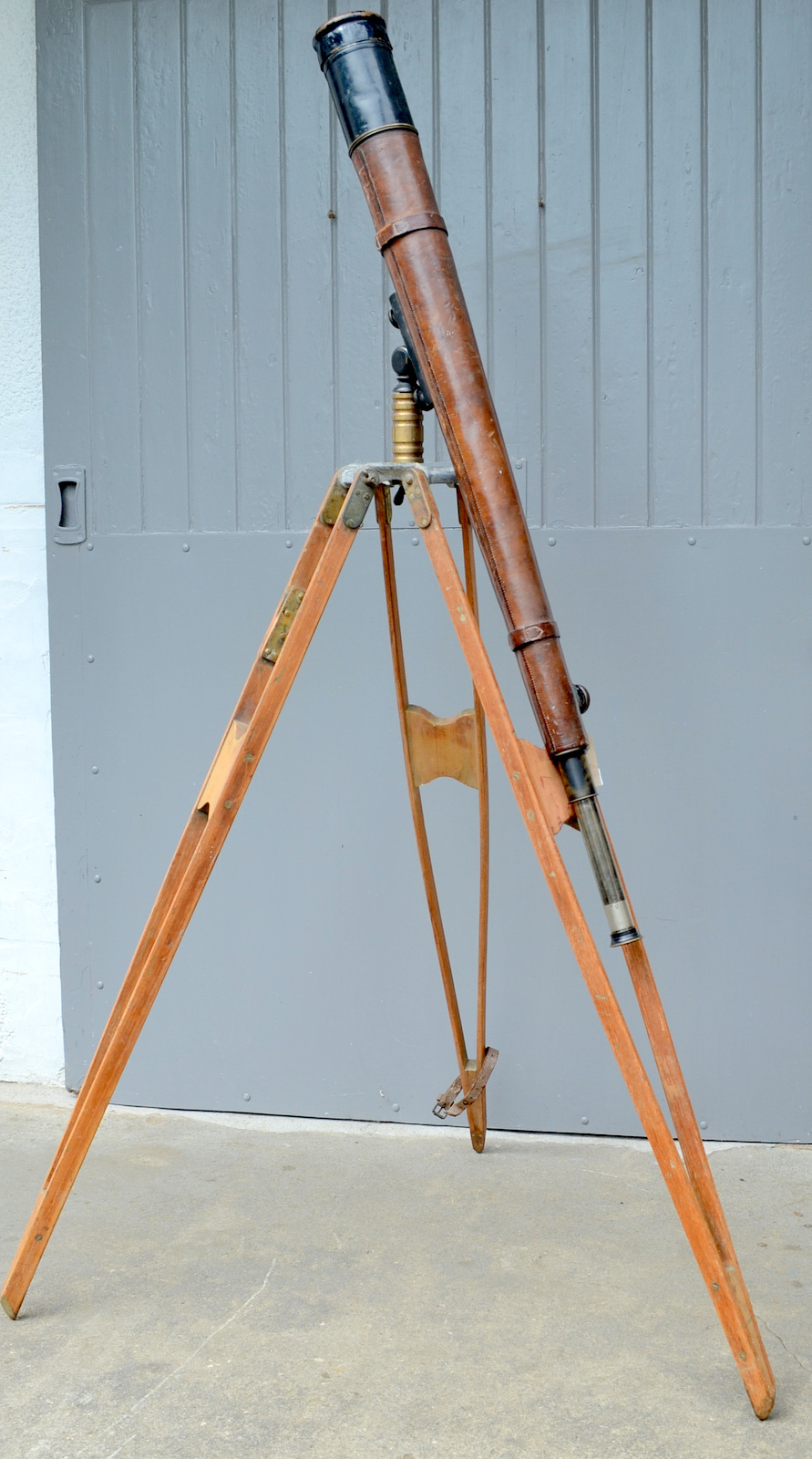 An Ex.W.D. brown leather clad 7.6cm two draw telescope Patt No. 333 telescope by W.Ottway & Co.