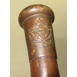 A weighted hardwood walking stick with a Royal Air Force finial, length 87cm.