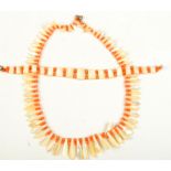 A coral and mother of pearl Art Deco necklace and a matching bracelet.