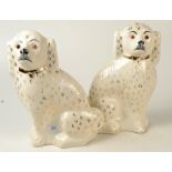 A pair of late Staffordshire large spaniels by Sadler with glass eyes, height 35.5cm.