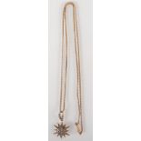 A 9ct. gold star pendant set with pearls on 9ct. gold chain. 2.