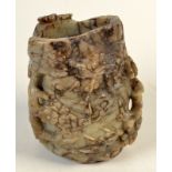 A Chinese carved, brown and grey striated soapstone brush pot, probably 19th century,