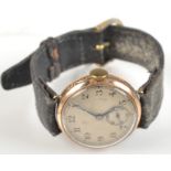 A gentleman's 9ct. gold cased wristwatch with engine turned silver face.