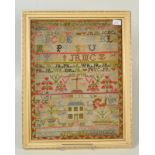 A Victorian woolwork sampler dated 1876.