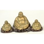A hollow brass Buddha on a hardwood stand, height including stand 17cm,