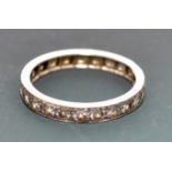 A platinum diamond set eternity ring. Condition Report: Ring size L.