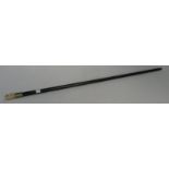 An ebony walking stick with a bone whistle finial, length 89cm.