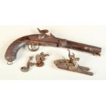 An early 19th century percussion native pistol with octagonal barrel and swivel ramrod,